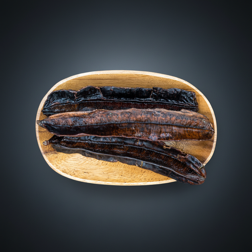 Aidan Fruit (Prekese) dried pods in a wooden bowl